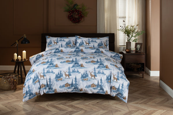 Deyongs Snowy Bear brushed cotton duvet set with a snowy forest scene in blue and white