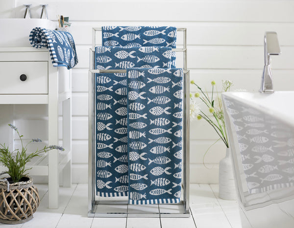 Small Fish cotton towels on a stand — ocean blue jacquard fish design