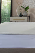 Memory Foam Mattress Topper styled on a bed - The Lyndon Company