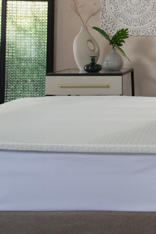 Memory Foam Mattress Topper styled on a bed - The Lyndon Company