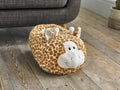 Cozytime Big Foot Warmer Giraffe on a sofa
