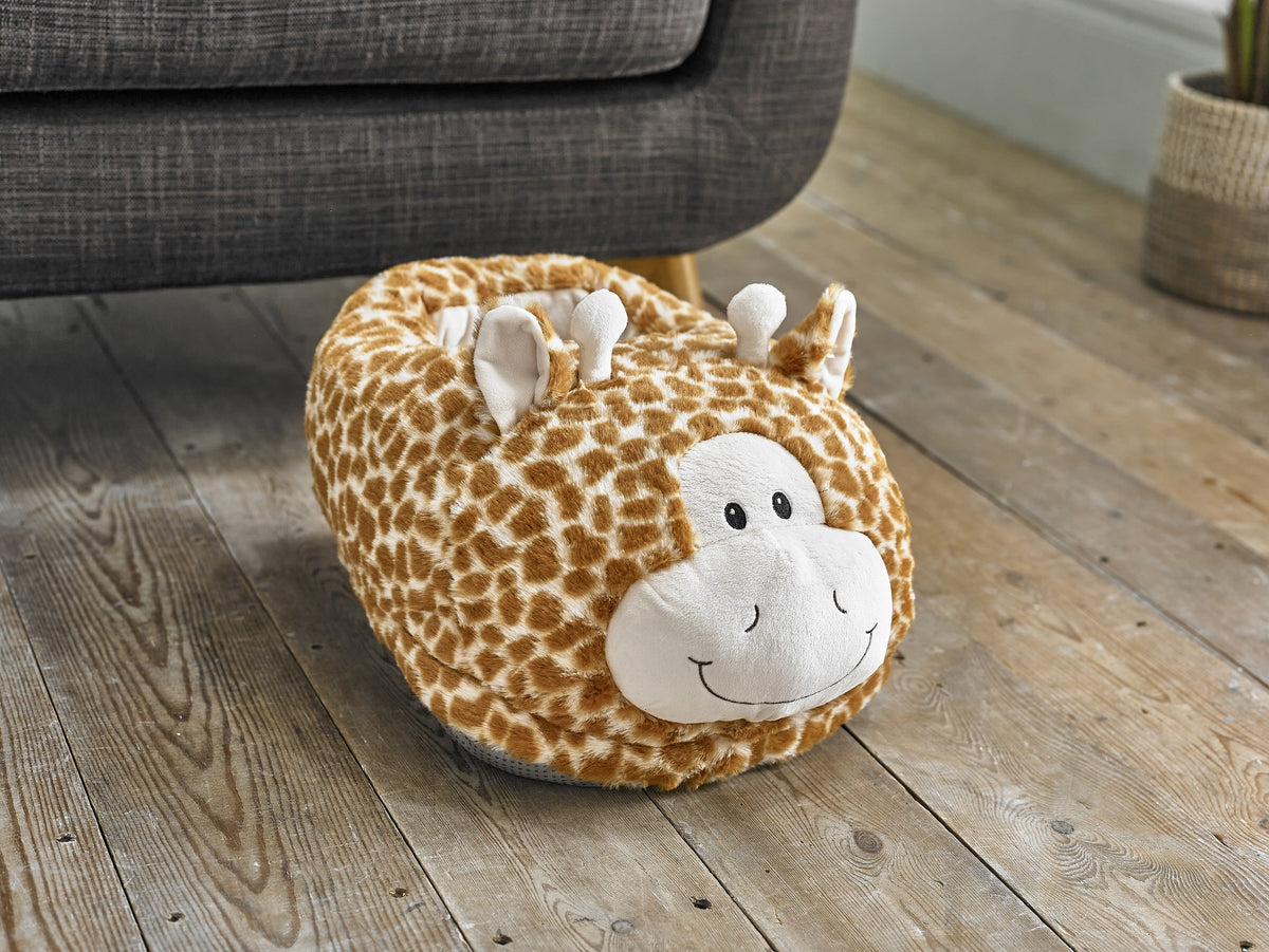 Cozytime Big Foot Warmer Giraffe on a sofa