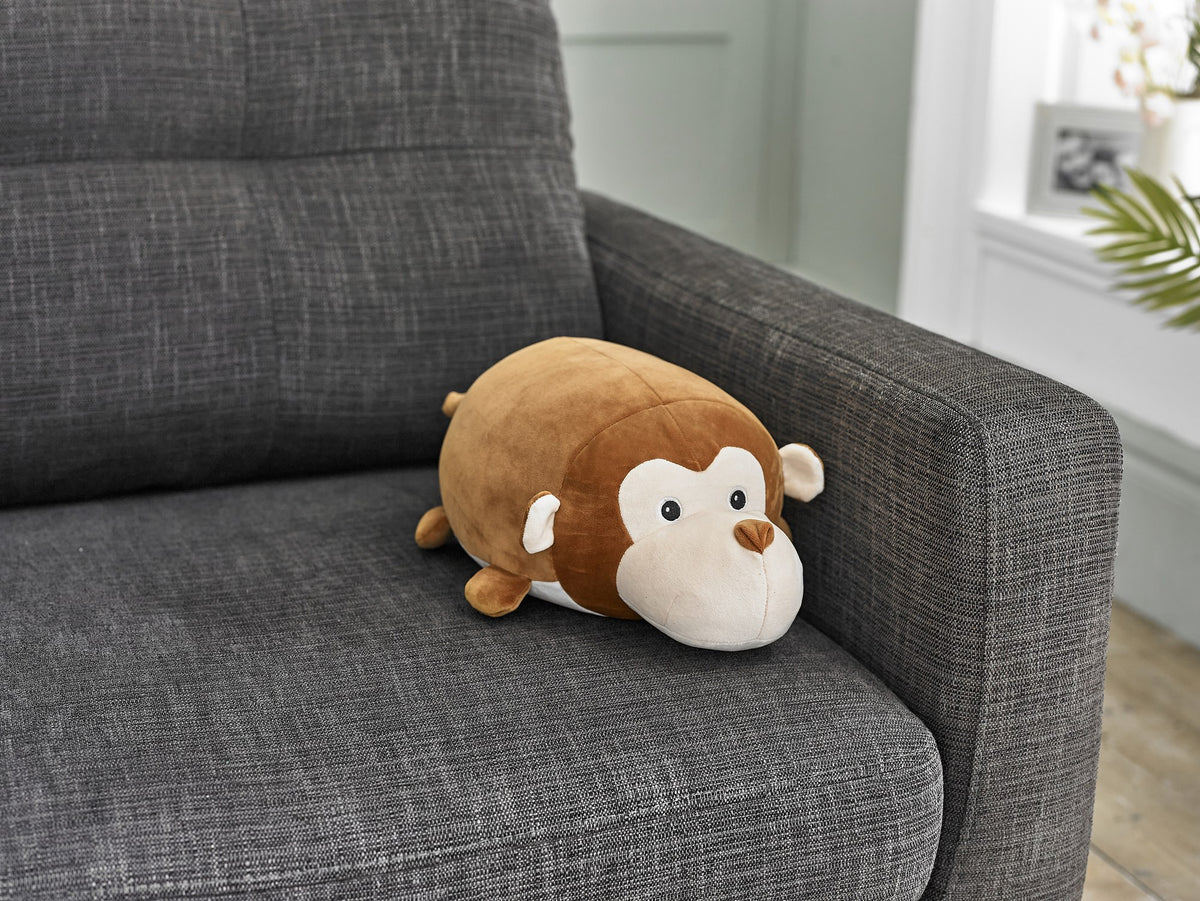 Cozytime Cozy Cuddler Monkey on a sofa