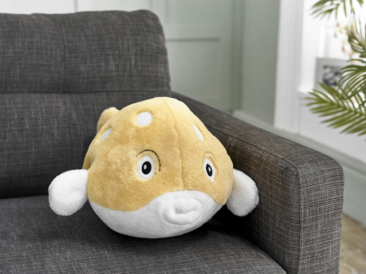 Cozytime Giant Handwarmer Pufferfish on a sofa